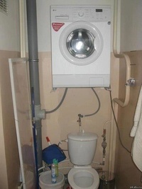 Smart Idea - The Washing Machine above the Toilet - Now pray it was well mounted..